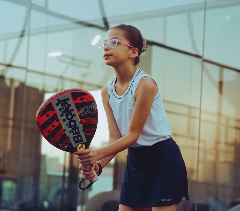 Young girl playing padel Padel